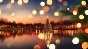 A Christmas tree illuminated with lights stands in the middle of a lake, reflecting on the water. Blurred colorful lights dance against a sunset backdrop, serving as perfect inspiration to embrace holiday themes and imagery in your winter marketing.