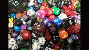 A diverse assortment of colorful dice, with various shapes, sizes, and numbers, piled together randomly like the vibrant array of activities planned for the Milton Public Library's adult programs this December 2024.