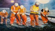 Workers in safety gear wield jackhammers on a road at night, their activity illuminated like a beautiful art exhibit. It's as if the scene hints at the upcoming November display at Milton Public Library's Wotiz Gallery.