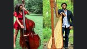 Zamora and Pola are set to host a magical sunset concert at Eustis Estate, featuring an enchanting duo: one playing a double bass in a red dress, the other beside a harp in a blue suit. Greenery sets the picturesque backdrop for this unforgettable evening.