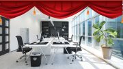 In this modern office, where desks and computers bathe in natural light from large windows, the potted plant and red drapes exude a vibrant energy. This space embodies the innovative spirit of Small Business Corner, illustrating how behind-the-scenes content can boost your small business.